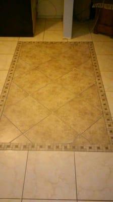 Removed wall seperating room and inlaid a decorative tile.