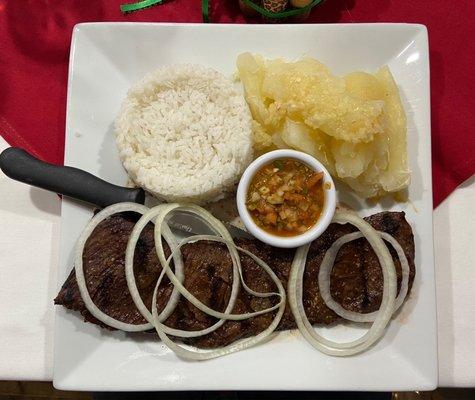 Churrasco con Chimichurri. Cooked to order with a side of white rice and boiled yucca topped with garlic