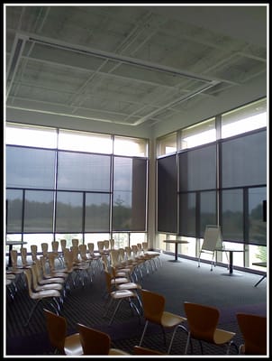 Insolroll solar screen shades for glare and sun control.