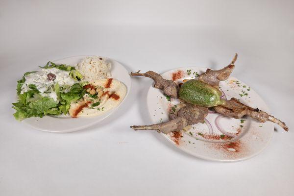 Lamb Shank - Served with Feta cheese salad, Hummus and rice.