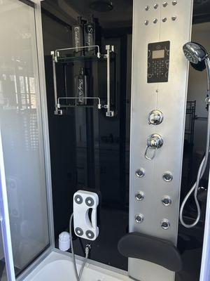 Jacuzzi Shower with Shampoo, Conditioner, and Body Wash. Stand up shower or sit down tub with Bluetooth Speaker and steam generator.