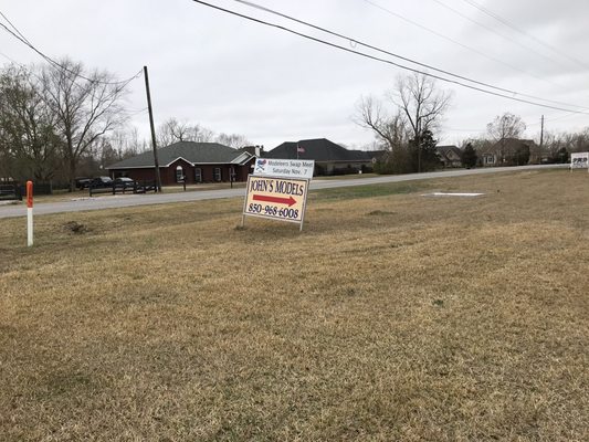 Sign by the road indicating location