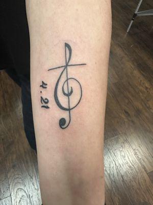 My first tattoo: treble clef/cross with birth date