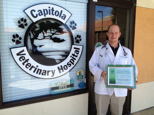 Dr May with Monterey Bay Green Business Award.  We have won several awards for our environmentally friendly business practices.