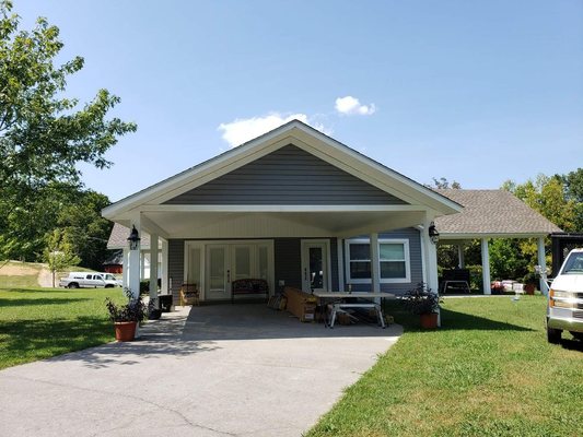 Vinyl siding and soffit, 5.25in wood trim to cap bottom of the gable.