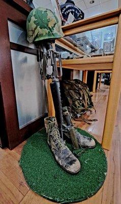 Soldiers boots and gun