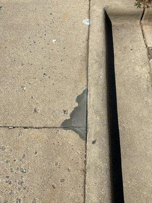 Large hole in commercial business sidewalk,patched to prevent trip hazards!