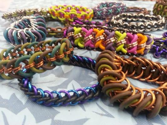 Various rubber ring & steel chainmail bracelets made by the chainmail instructor. Gorgeous!