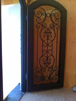 Entry door with iron deco and glass