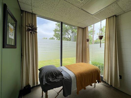 With natural lighting from the floor-to-ceiling windows, you are sure to feel relaxed during your Reiki session.