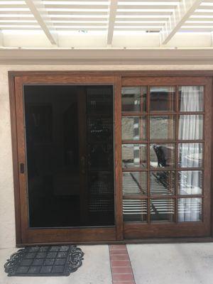 Wooden sliding screen door AFTER with pet screen installed