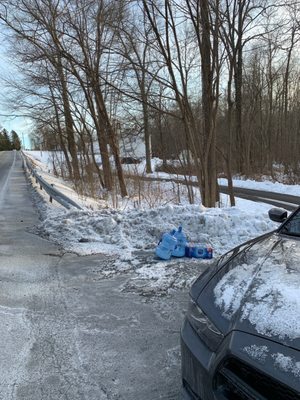 Damaged water 5 gallon jugs and 36 pack of water bottles left in the snow.  Look at distance from house.  You call that a delivery?!!!