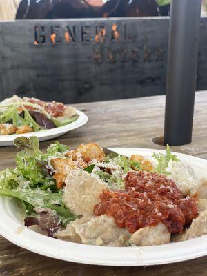 Sausage ravioli with Alfredo and marinara and Caesar salad.