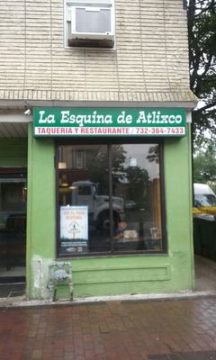 Storefront on corner by municipal parking