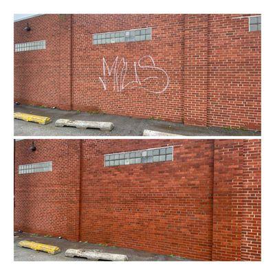 Graffiti removal on brick.