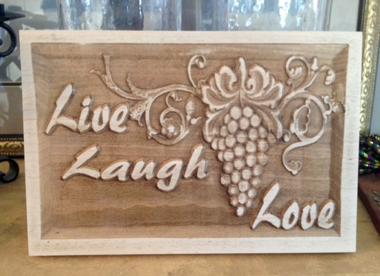 Carved in solid maple is this simple message --Live ,Laugh, Love !!