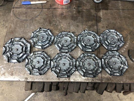 Hand forged iron rosettes.