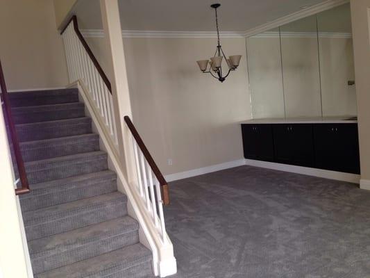 Patterned carpet in dining room and stairs