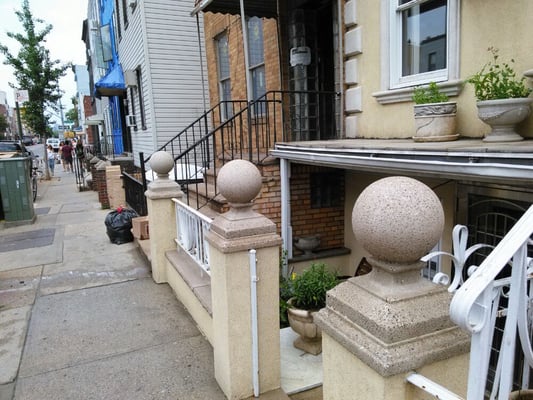 Stone ball caps now cleaned by our power washing. Go see the before picture call for free estimate