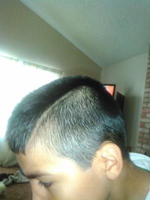 This is the side with the tapered part she did and no fade!! Horrible! It looks like a half Mohawk!