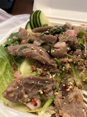 "Pork Waterfall" salad over rice (under lettuce to separate). So fresh and flavorful! She always uses high quality meats.