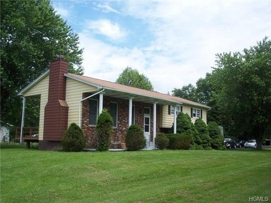 Unusual bi-level located on a pretty cul-de-sac with over-sized Living Room with fireplace and vaulted ceiling...