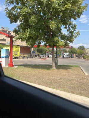 Car wash from the back with view towards gas station