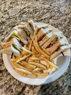 Turkey club sandwich with french fries