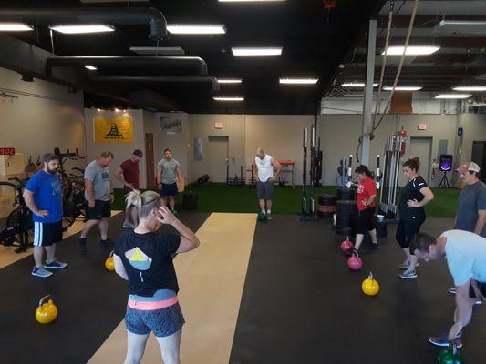 April Gideon (coach) leading a Crossfit class.