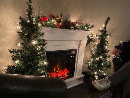 Two Corner spaces with sofas and electric fireplaces