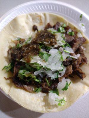 Carne asada taco with corn tortilla