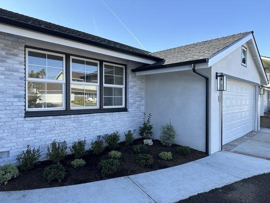 Beautiful black gutters match roof seamlessly.