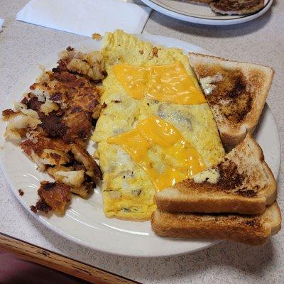 Mushroom, onion n cheese omelet with white toast n well done hashbrowns