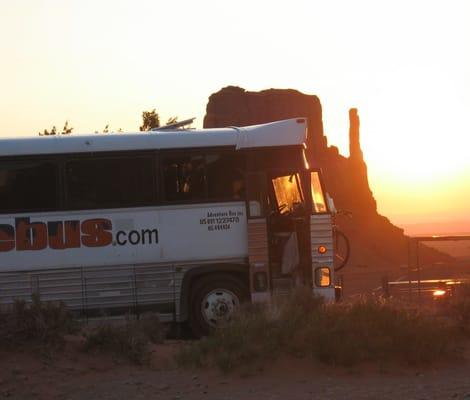 Adventure Bus at Monument Valley at sunrise.