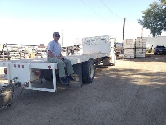 My pops on the flat of the truck outside the bee farm.