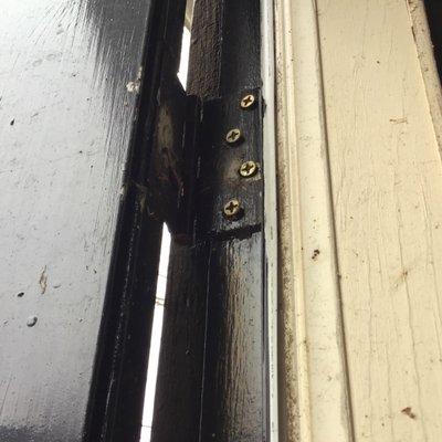 Tighten loose hinge screws to maintain integrity and proper operation of the door.