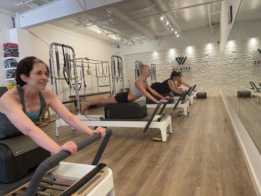 Swan forward on the Pilates Long Box, an accessory added onto the Reformer. We add springs to give resistance...or take it away ;)