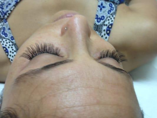 Another picture of Amy who says that her lashes were clumped, but it looks fine when she got the service done. Thank You.