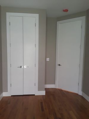 Moldings installation, skim coat , paint , door installed , floors polished & kitchen cabinet installed in Astoria Queens.