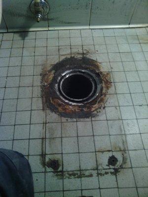 Repairing a broken cast iron toilet flange