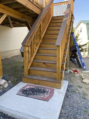 Rear deck Stairs with landing. Vinyl composite decking treads and top rail.