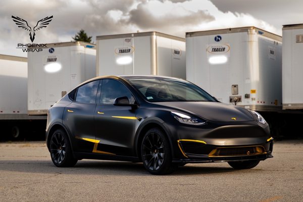 Tesla model Y / satin black - chrome gold decal.