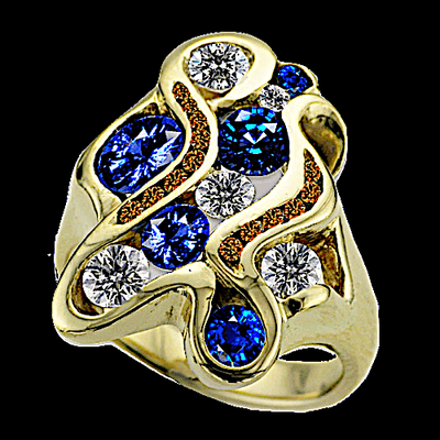 Custom 14k Gold ring with Montana Sapphires, white and bronze Diamonds.