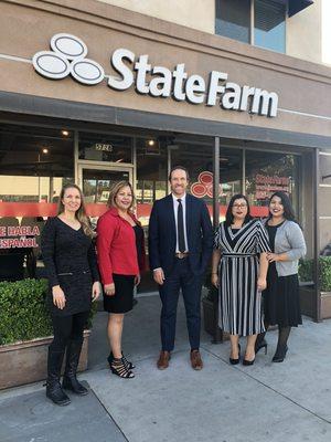 Jim Olson & staff in front of the office