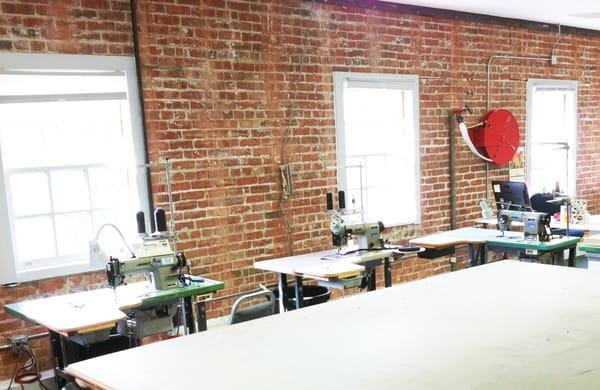 A few of our commercial sewing machines in the converted chicken hatchery building.