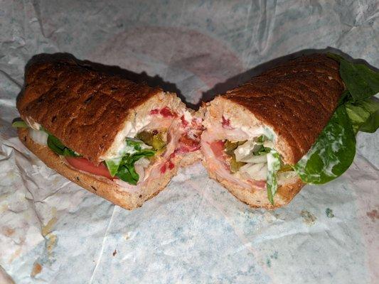 Turkey shorti on wheat w spinach, TMO, pepper spread and jalapenos