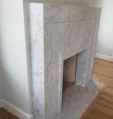 White Carrara marble surround and hearth