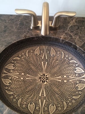 Master Bath Remodel.           Lilies Flore Kolher sink with Champagne Bronze  Delta Faucet mounted to Emperdor Dark Marble top.