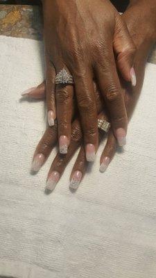 Full set acrylic with pink and white French gel, followed with silver glitter.