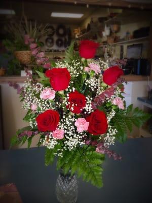 Fresh arrangement with roses and carnations.